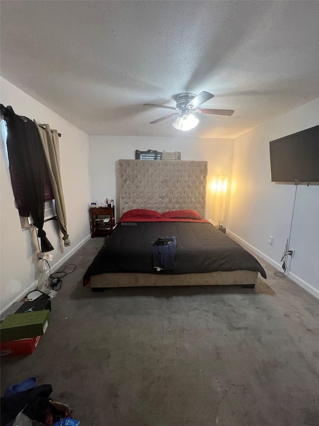 unfurnished bedroom featuring carpet flooring, ceiling fan, and a textured ceiling