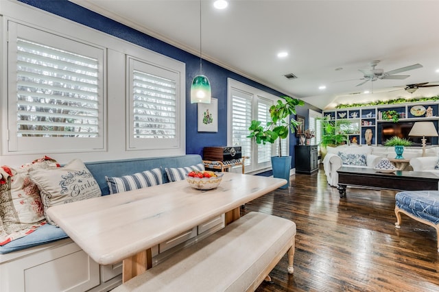 dining area with ceiling fan, breakfast area, dark hardwood / wood-style floors, and ornamental molding