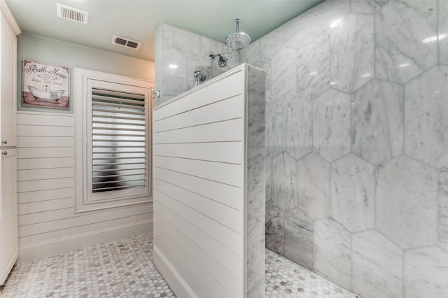 bathroom featuring tile patterned flooring and a shower