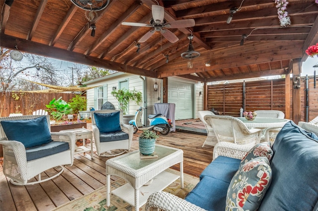 wooden terrace featuring ceiling fan