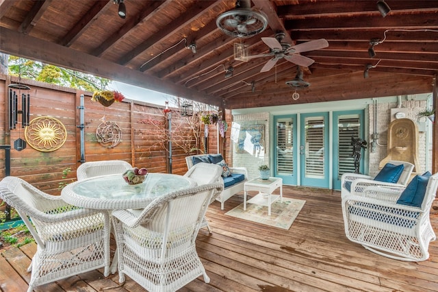 wooden terrace featuring ceiling fan