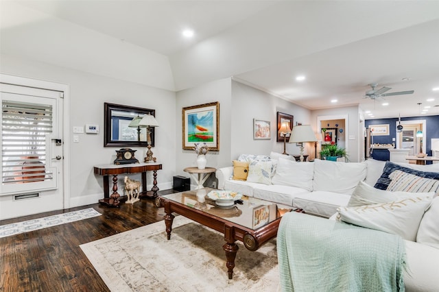 living room featuring dark hardwood / wood-style flooring and ceiling fan