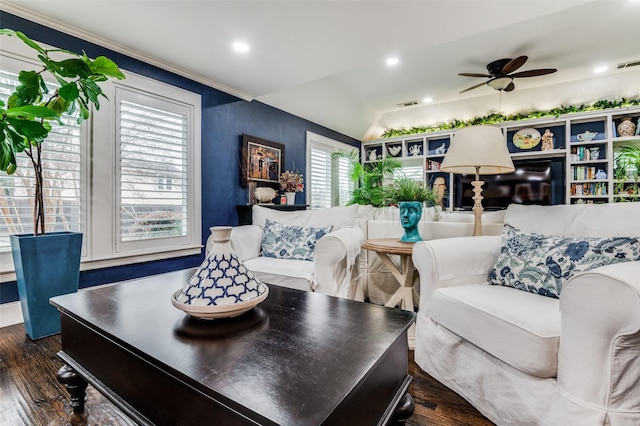 living room with dark hardwood / wood-style flooring and ceiling fan