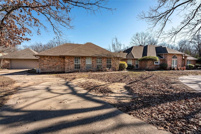 ranch-style house featuring a garage