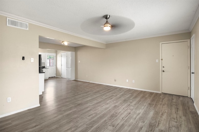 unfurnished living room with wood-type flooring, a textured ceiling, ceiling fan, and ornamental molding