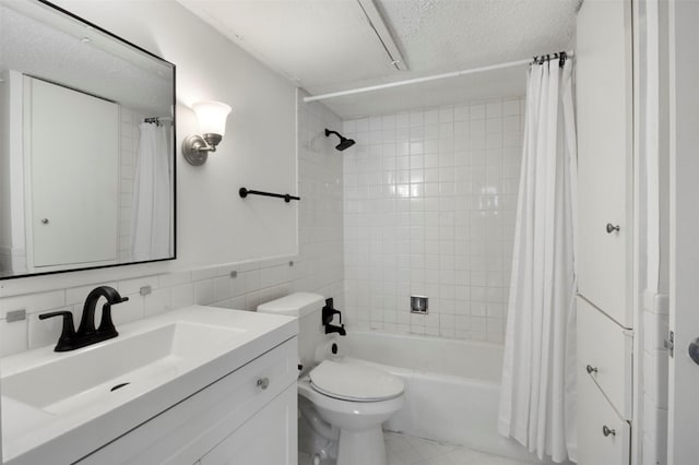 full bathroom featuring shower / bath combo, vanity, backsplash, a textured ceiling, and tile walls