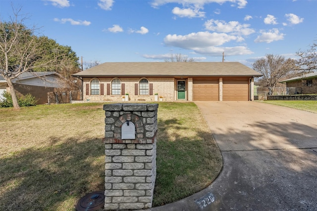 single story home featuring a front lawn and a garage