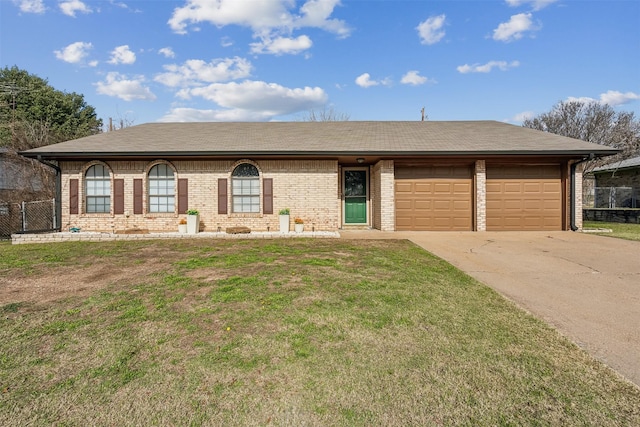 ranch-style house featuring a garage and a front yard