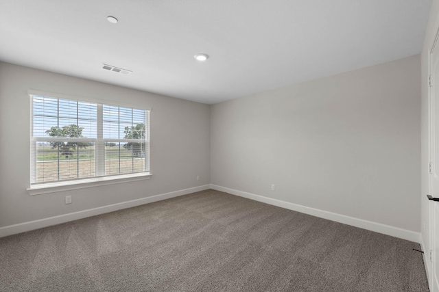 empty room with carpet flooring