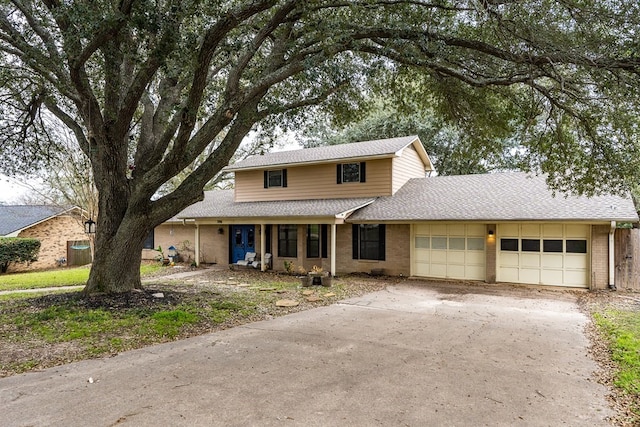 view of front property with central AC and a garage