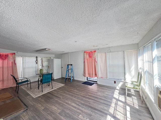 sitting room with hardwood / wood-style flooring