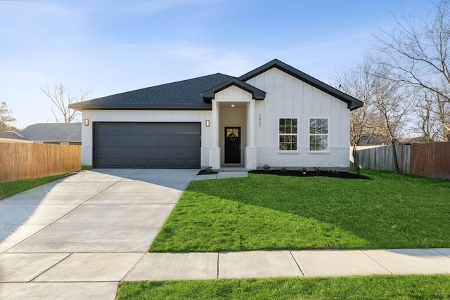 view of front of property with a garage and a front yard