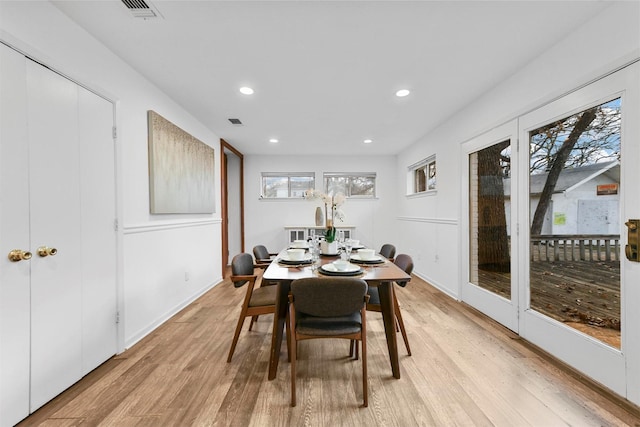 dining space with light wood-type flooring