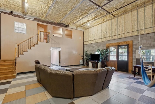 living room with a towering ceiling