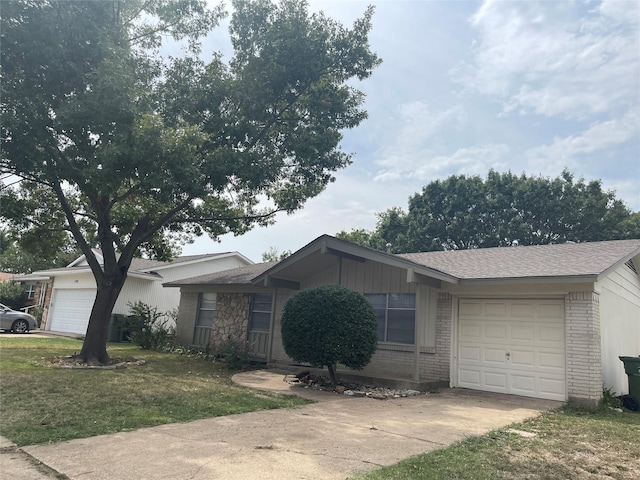 single story home featuring a garage and a front lawn