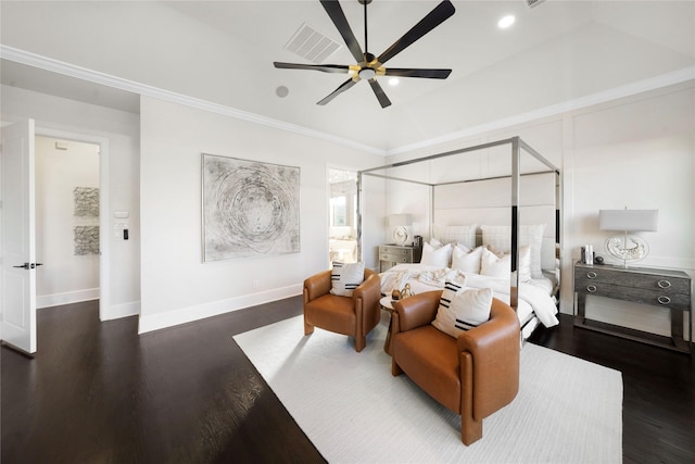 bedroom with ornamental molding, dark hardwood / wood-style floors, and ceiling fan