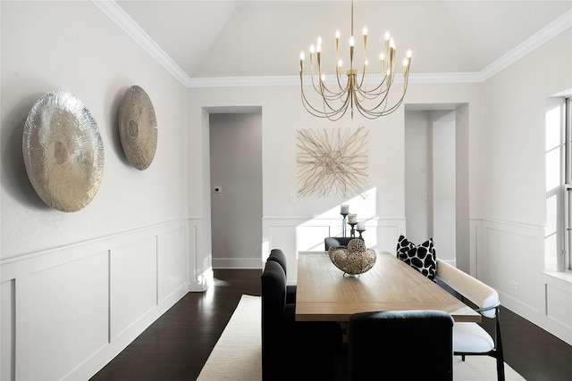 dining area featuring dark hardwood / wood-style flooring, crown molding, lofted ceiling, and a chandelier