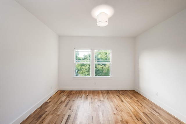 spare room with light hardwood / wood-style floors