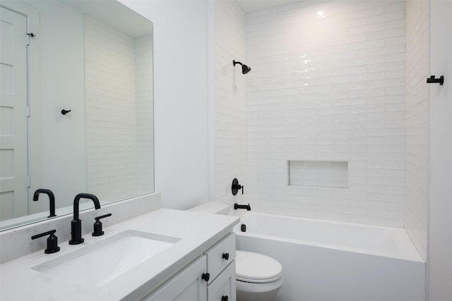 full bathroom featuring vanity, toilet, and tiled shower / bath