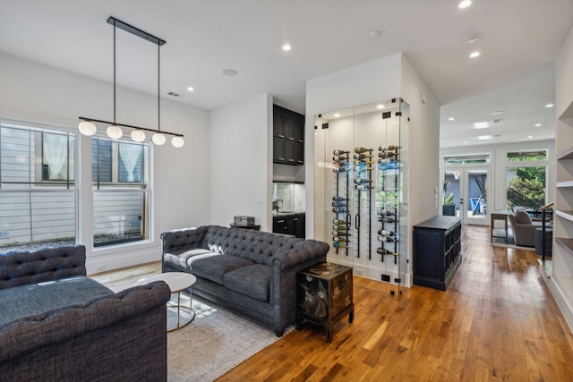 living room featuring wood-type flooring and french doors