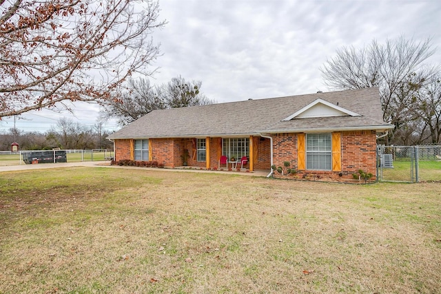 ranch-style house featuring a front lawn