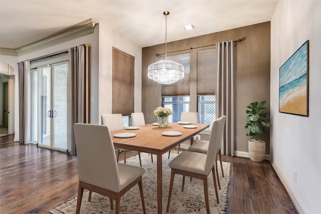 dining space featuring an inviting chandelier and dark hardwood / wood-style flooring