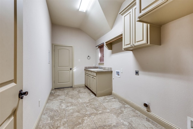 clothes washing area featuring hookup for an electric dryer, cabinets, sink, and hookup for a washing machine