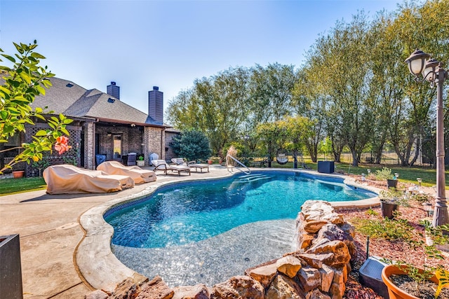 view of pool featuring a patio area