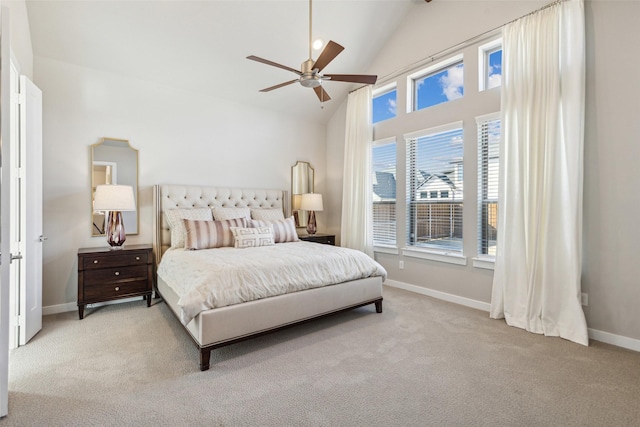 bedroom with ceiling fan, light colored carpet, and lofted ceiling