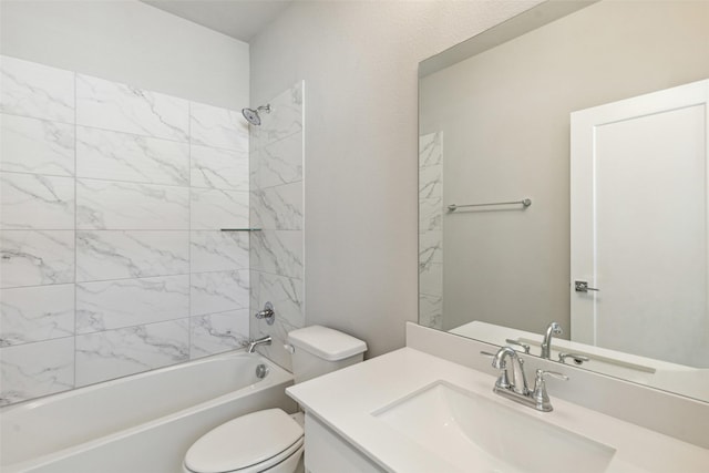 full bathroom featuring vanity, tiled shower / bath combo, and toilet