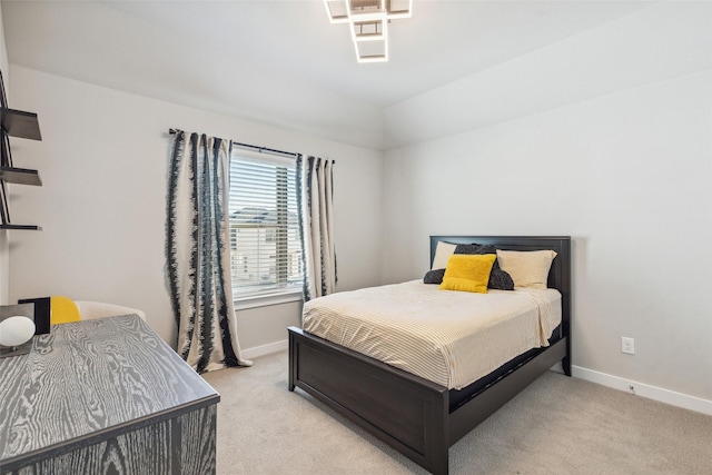 bedroom with light colored carpet