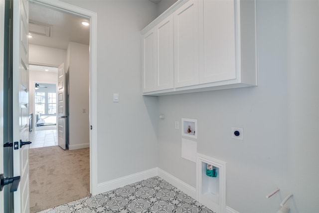 laundry area with cabinets, hookup for a gas dryer, hookup for a washing machine, light tile patterned floors, and hookup for an electric dryer