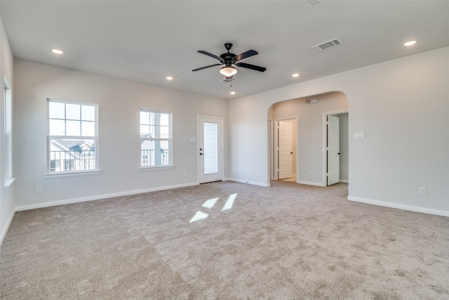 empty room featuring light carpet and ceiling fan