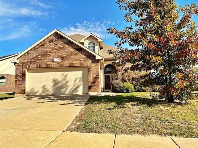 front facade with a garage and a front lawn