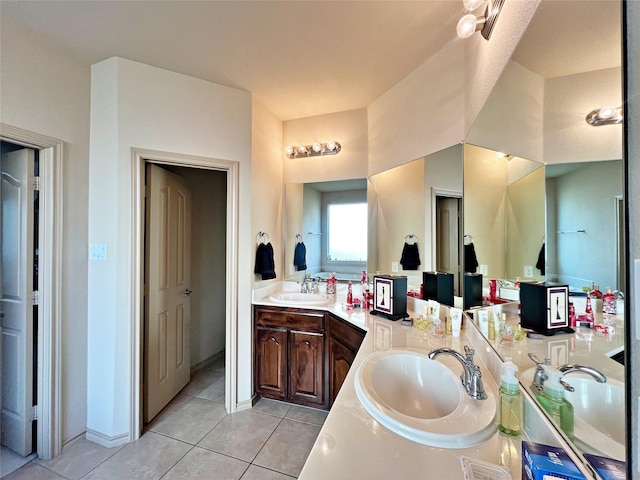 bathroom with tile patterned floors and vanity