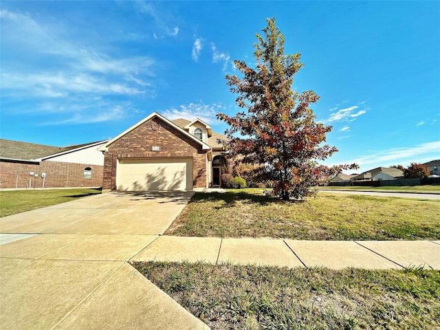 view of front of home with a garage and a front yard