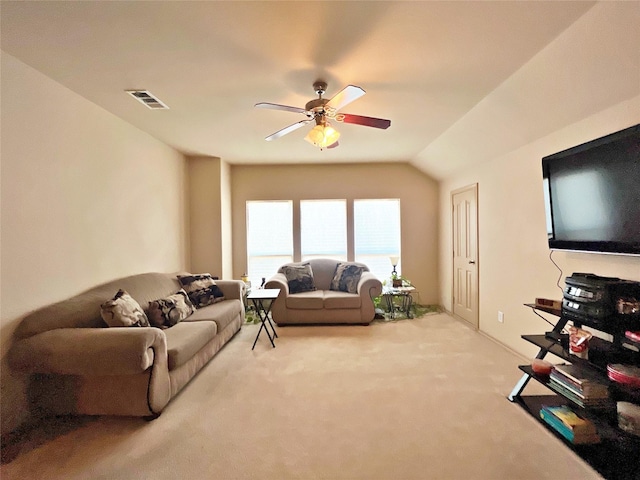 living room featuring ceiling fan, carpet flooring, and lofted ceiling