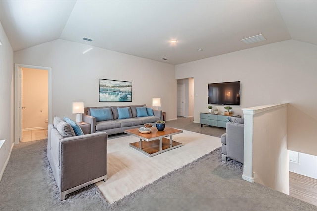 living room with vaulted ceiling and light carpet