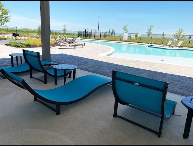 view of swimming pool featuring a patio area