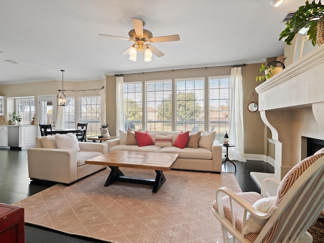 living room with ceiling fan with notable chandelier