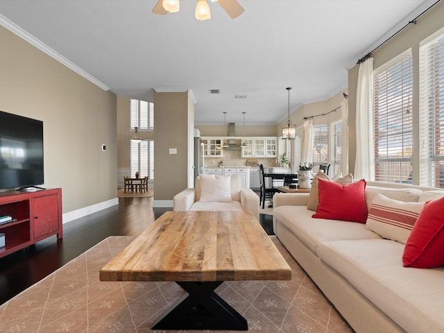 living room with ceiling fan, dark hardwood / wood-style floors, and ornamental molding