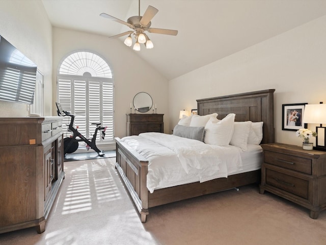 carpeted bedroom featuring ceiling fan and lofted ceiling