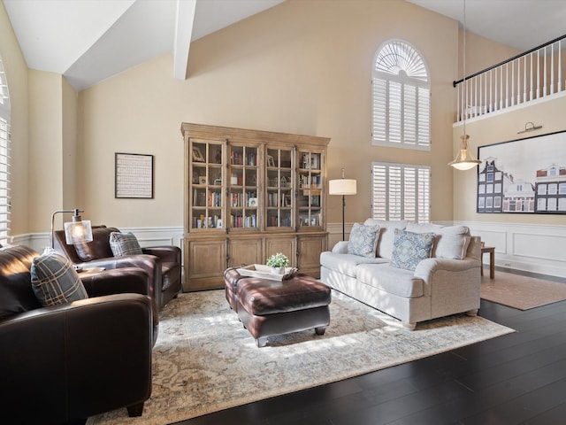 living room with lofted ceiling and wood-type flooring