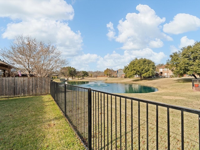 exterior space with a water view and a yard