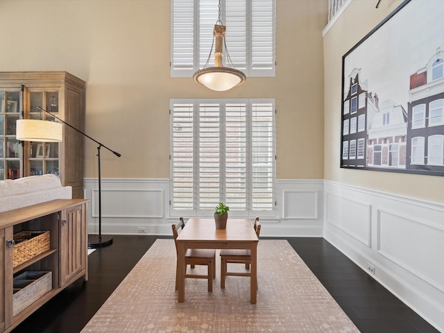 dining area featuring dark wood-type flooring