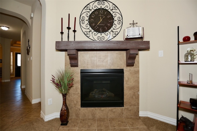 interior details with a tiled fireplace