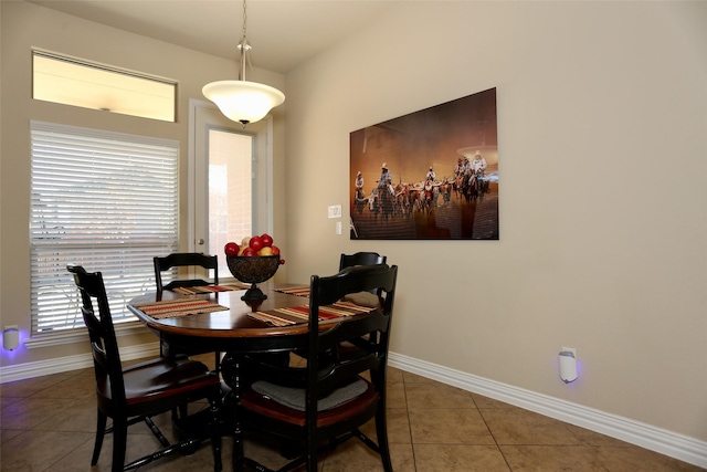 dining space with tile patterned floors and a wealth of natural light