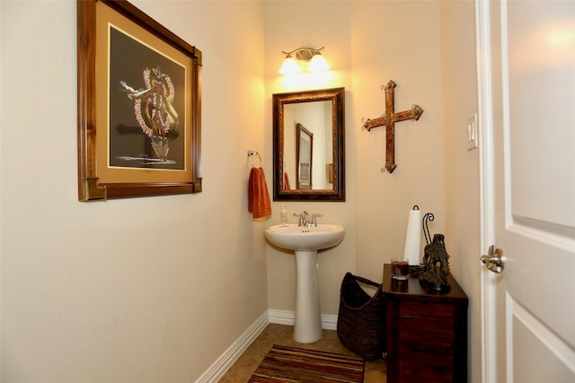 bathroom with tile patterned floors and sink