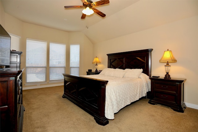 carpeted bedroom featuring ceiling fan and lofted ceiling