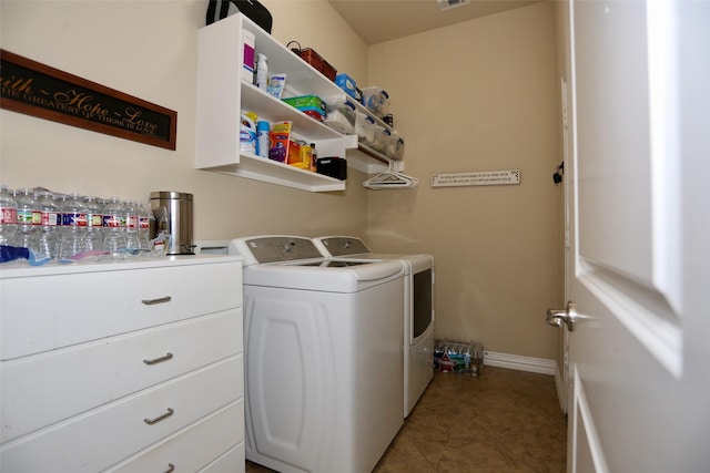 clothes washing area with tile patterned flooring and washing machine and clothes dryer